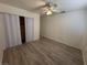 Bright bedroom with ceiling fan and laminate flooring at 132 W Victory Rd, Henderson, NV 89015