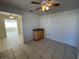 Dining area with tile floor, ceiling fan and access to kitchen at 132 W Victory Rd, Henderson, NV 89015