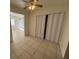 Dining area with tile floor, ceiling fan and access to kitchen and backyard at 132 W Victory Rd, Henderson, NV 89015