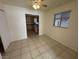 Dining area with tile floor, ceiling fan and view of kitchen at 132 W Victory Rd, Henderson, NV 89015