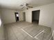 Spacious living room with tile floors and ceiling fan at 132 W Victory Rd, Henderson, NV 89015