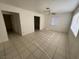 Spacious living room with tile floors and ceiling fan at 132 W Victory Rd, Henderson, NV 89015