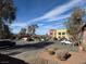 Spacious parking lot with multiple cars parked in front of commercial building at 132 W Victory Rd, Henderson, NV 89015