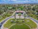 Gated entrance to the community with palm trees and landscaping at 7365 Mission Hills Dr, Las Vegas, NV 89113