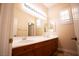 Double vanity bathroom with updated fixtures and tile flooring at 9408 Forest Edge Ave, Las Vegas, NV 89149