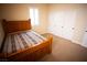 Bedroom with wooden bed frame and closet at 9408 Forest Edge Ave, Las Vegas, NV 89149