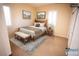 Cozy bedroom with wood bed frame and a bench at the foot at 9408 Forest Edge Ave, Las Vegas, NV 89149