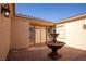 Courtyard entry featuring a fountain and double doors at 9408 Forest Edge Ave, Las Vegas, NV 89149