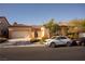 Front view of house with two-car garage and landscaping at 9408 Forest Edge Ave, Las Vegas, NV 89149