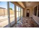 Sunroom with sliding glass doors and view of backyard at 9408 Forest Edge Ave, Las Vegas, NV 89149