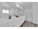 Bathroom featuring double sinks and a large mirror over white cabinets at 2196 Pescara Ct, Las Vegas, NV 89123