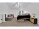 A bright primary bedroom featuring gray carpet, a ceiling fan, and vaulted ceilings at 2196 Pescara Ct, Las Vegas, NV 89123