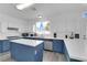 Bright kitchen with stainless steel appliances, blue cabinets, and a kitchen island at 2196 Pescara Ct, Las Vegas, NV 89123