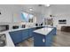 Bright eat-in kitchen features stainless steel appliances, and a blue island at 2196 Pescara Ct, Las Vegas, NV 89123