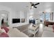 Cozy living room with a fireplace, white sofa, hardwood floors, and open concept design at 2196 Pescara Ct, Las Vegas, NV 89123