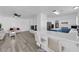 Open floor plan with a fireplace, bar seating, and lots of natural light at 2196 Pescara Ct, Las Vegas, NV 89123