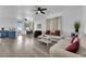 Bright and airy living room features hardwood floors, and a view of the kitchen and dining area at 2196 Pescara Ct, Las Vegas, NV 89123