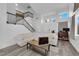 Bright and airy living room features hardwood floors, high ceilings, and a staircase with black railings at 2196 Pescara Ct, Las Vegas, NV 89123