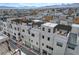 Aerial view of modern townhomes, showcasing rooftop decks and mountain views at 651 Sentinel Spire St, Las Vegas, NV 89138