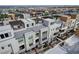 Aerial view of community, showcasing homes with rooftop decks and city views at 651 Sentinel Spire St, Las Vegas, NV 89138