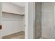 Walk-in closet and shower with grey tile at 651 Sentinel Spire St, Las Vegas, NV 89138