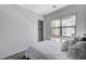 Bedroom with window, closet, and neutral decor at 651 Sentinel Spire St, Las Vegas, NV 89138