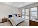 Bright bedroom with large windows and plush bedding at 651 Sentinel Spire St, Las Vegas, NV 89138