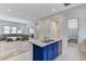 Open concept kitchen with island and view into living room at 651 Sentinel Spire St, Las Vegas, NV 89138