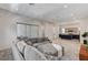 Open concept living room with a view of the kitchen and access to a patio at 651 Sentinel Spire St, Las Vegas, NV 89138