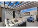 Modern rooftop deck features a pergola and comfortable seating at 651 Sentinel Spire St, Las Vegas, NV 89138