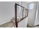 Modern staircase with metal railings and carpeted steps at 651 Sentinel Spire St, Las Vegas, NV 89138