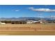 The backyard features mountain views behind a decorative block wall on flat dirt property at 1120 W Gray Fox Way, Pahrump, NV 89048