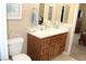 Bathroom vanity features a bright marble counter and stylish wood cabinetry at 1120 W Gray Fox Way, Pahrump, NV 89048