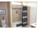 Bathroom boasts a bathtub with tan tile surround, shower and mosaic accents at 1120 W Gray Fox Way, Pahrump, NV 89048