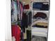 Organized closet with hanging clothes and shelves with folded items at 1120 W Gray Fox Way, Pahrump, NV 89048