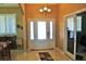Bright entryway with decorative front door, sidelights, tile flooring, and chandelier at 1120 W Gray Fox Way, Pahrump, NV 89048