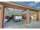 Detached two-car garage featuring high ceilings, epoxy floors, and ample storage and workspace at 1120 W Gray Fox Way, Pahrump, NV 89048