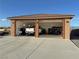 Detached two-car garage featuring high ceilings, epoxy floors, and ample storage and workspace at 1120 W Gray Fox Way, Pahrump, NV 89048