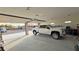 Large garage featuring a parked truck and open garage doors with an exterior view at 1120 W Gray Fox Way, Pahrump, NV 89048