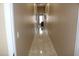 Long hallway with tile flooring and neutral wall paint with white trim throughout at 1120 W Gray Fox Way, Pahrump, NV 89048