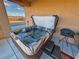 Outdoor hot tub with a cover on a covered patio area at 1120 W Gray Fox Way, Pahrump, NV 89048