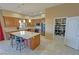 Spacious kitchen featuring an island with seating, stainless steel appliances, and a walk-in pantry at 1120 W Gray Fox Way, Pahrump, NV 89048