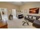 A living room with gray furniture, a mini fridge, and glass table at 1120 W Gray Fox Way, Pahrump, NV 89048