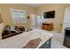 Relaxing living room area with a large TV, comfortable couch, and access to the backyard at 1120 W Gray Fox Way, Pahrump, NV 89048