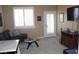 Cozy living room with shutters, couch, entertainment center, and coffee table at 1120 W Gray Fox Way, Pahrump, NV 89048