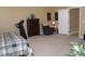 Comfortable main bedroom with a dresser, treadmill, and neutral color palette at 1120 W Gray Fox Way, Pahrump, NV 89048