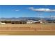 Expansive property with mountain views under a blue sky with bright, fluffy clouds at 1120 W Gray Fox Way, Pahrump, NV 89048