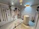 Well-organized storage room featuring pegboard walls and skylight offering natural light at 1120 W Gray Fox Way, Pahrump, NV 89048