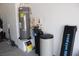 Utility room with water heater, water softener, and home gym equipment at 1120 W Gray Fox Way, Pahrump, NV 89048