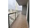 Private balcony with tiled flooring and glass railings offering city views at 200 W Sahara Ave # 1609, Las Vegas, NV 89102